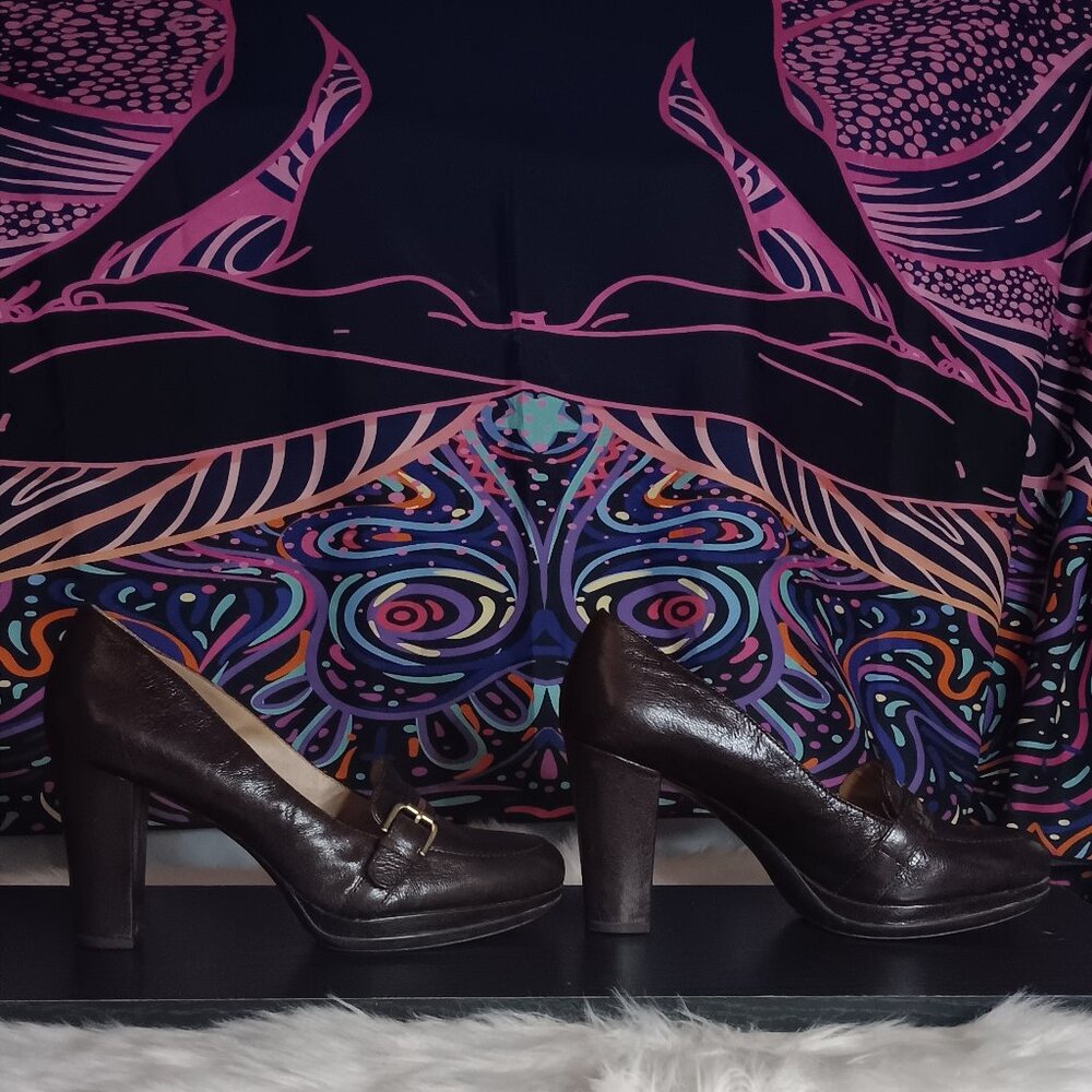 Brown Aldo all leather/wood platform heel.